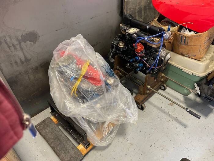 Two further engines, one bagged and one on a stand